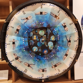 Artwork of a Clock with Swimmers as the numbered positions