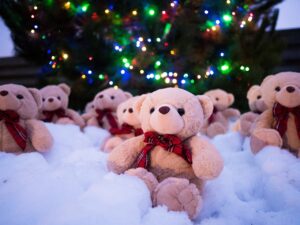 Teddy bears around the bottom of a Christmas tree