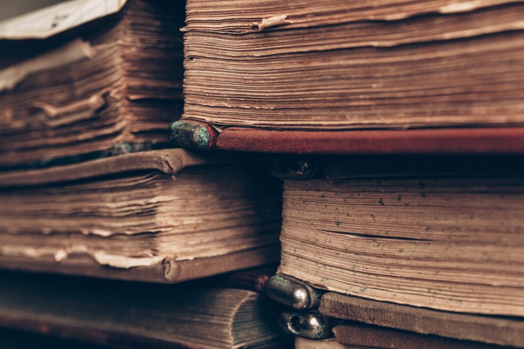 Close-up of old books that are stacked together