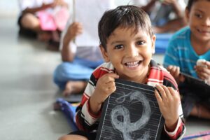 Boy laughing in school