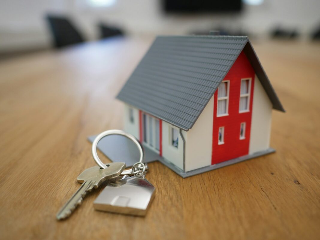 A toy house, with a set of keys attached to it