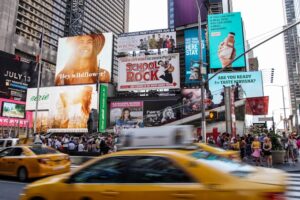 Unsplash Image of Vehicles on roadway near buildings photo.