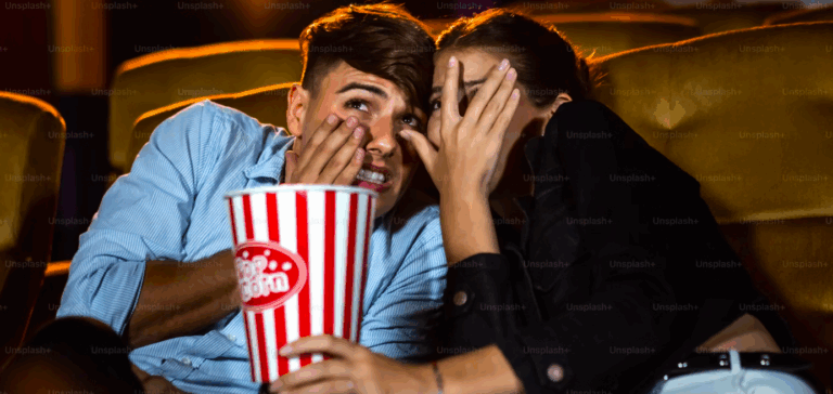 A couple of lovers watching movie shock and eyes close in the movie theater cinema - Horror Image on Unsplash