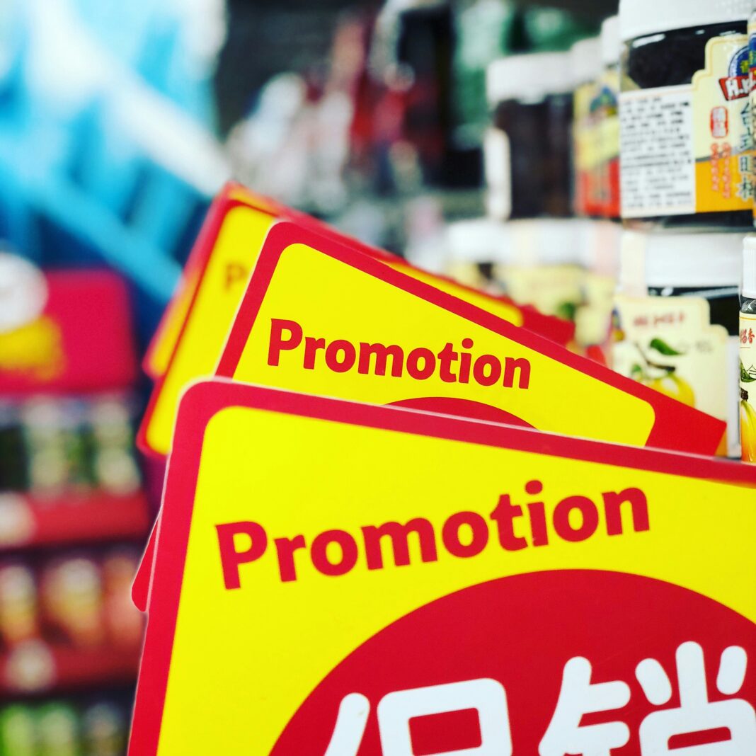 Yellow promotion signs in a supermarket