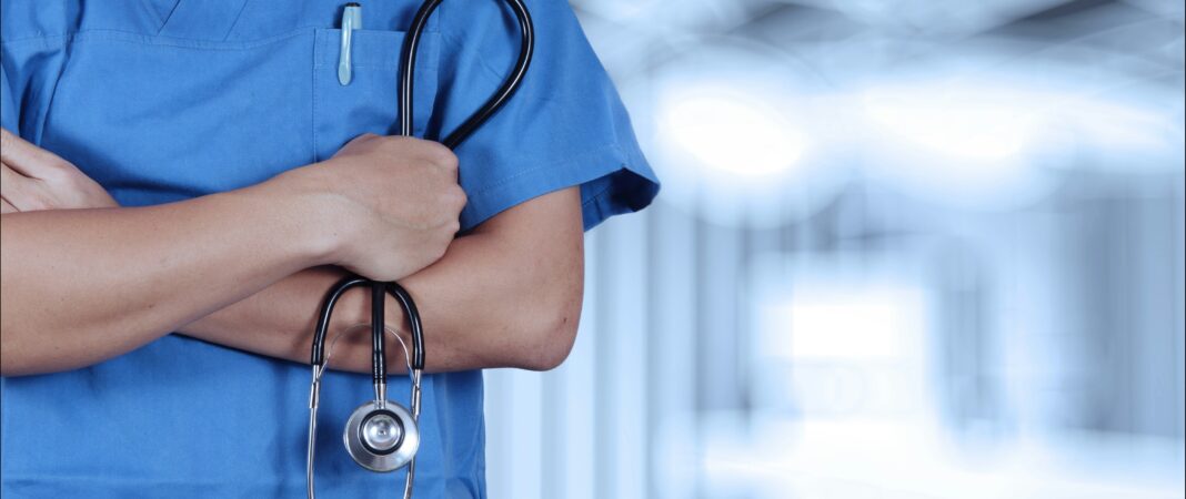 A doctor crossing their arms